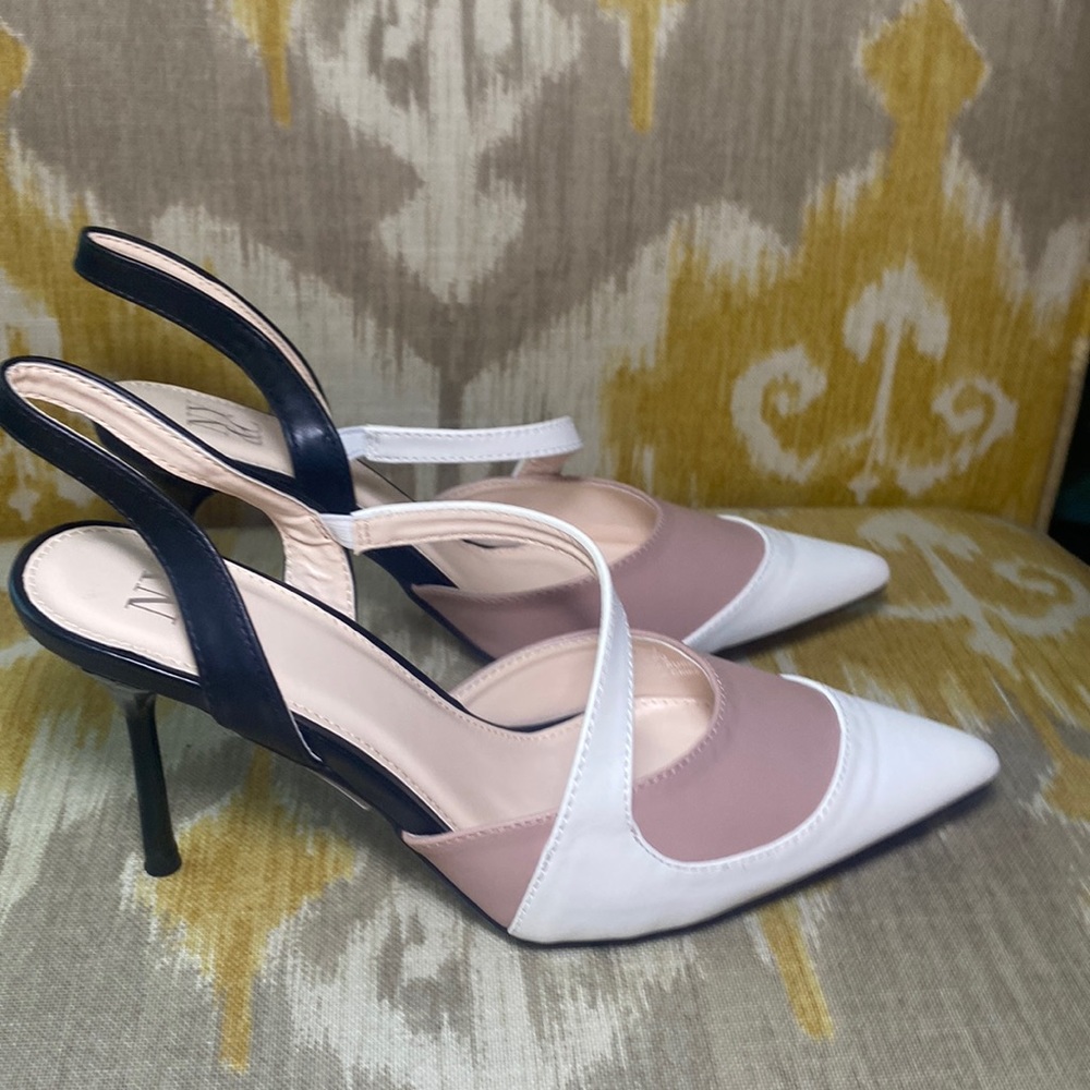 Pink, white and black heels
